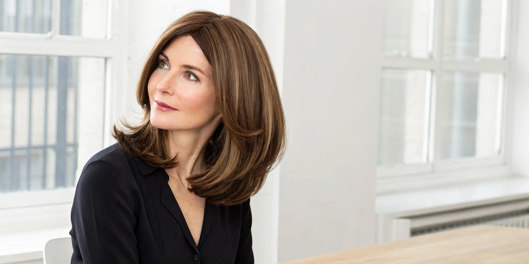 A comfortable, medium length medical wig with soft layers for a natural look.