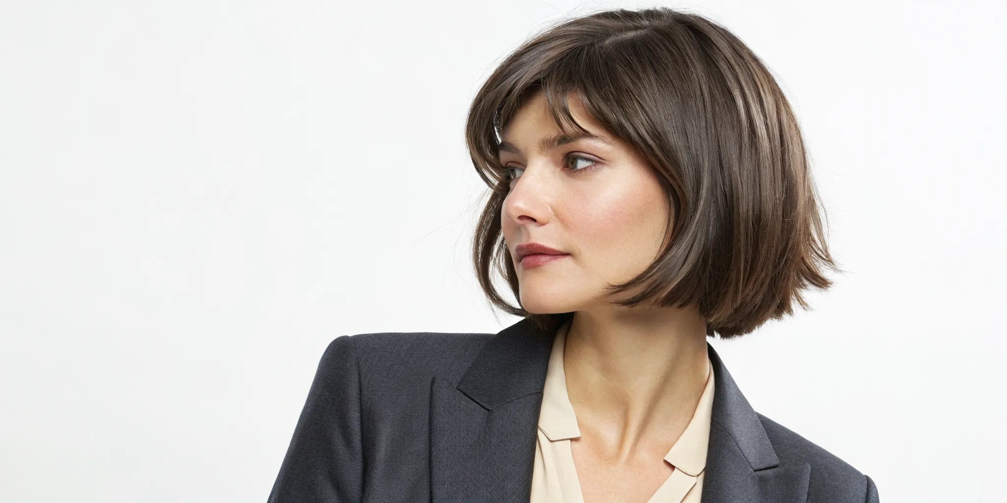 A realistic short brown wolf cut wig with shaggy layers and face-framing bangs.