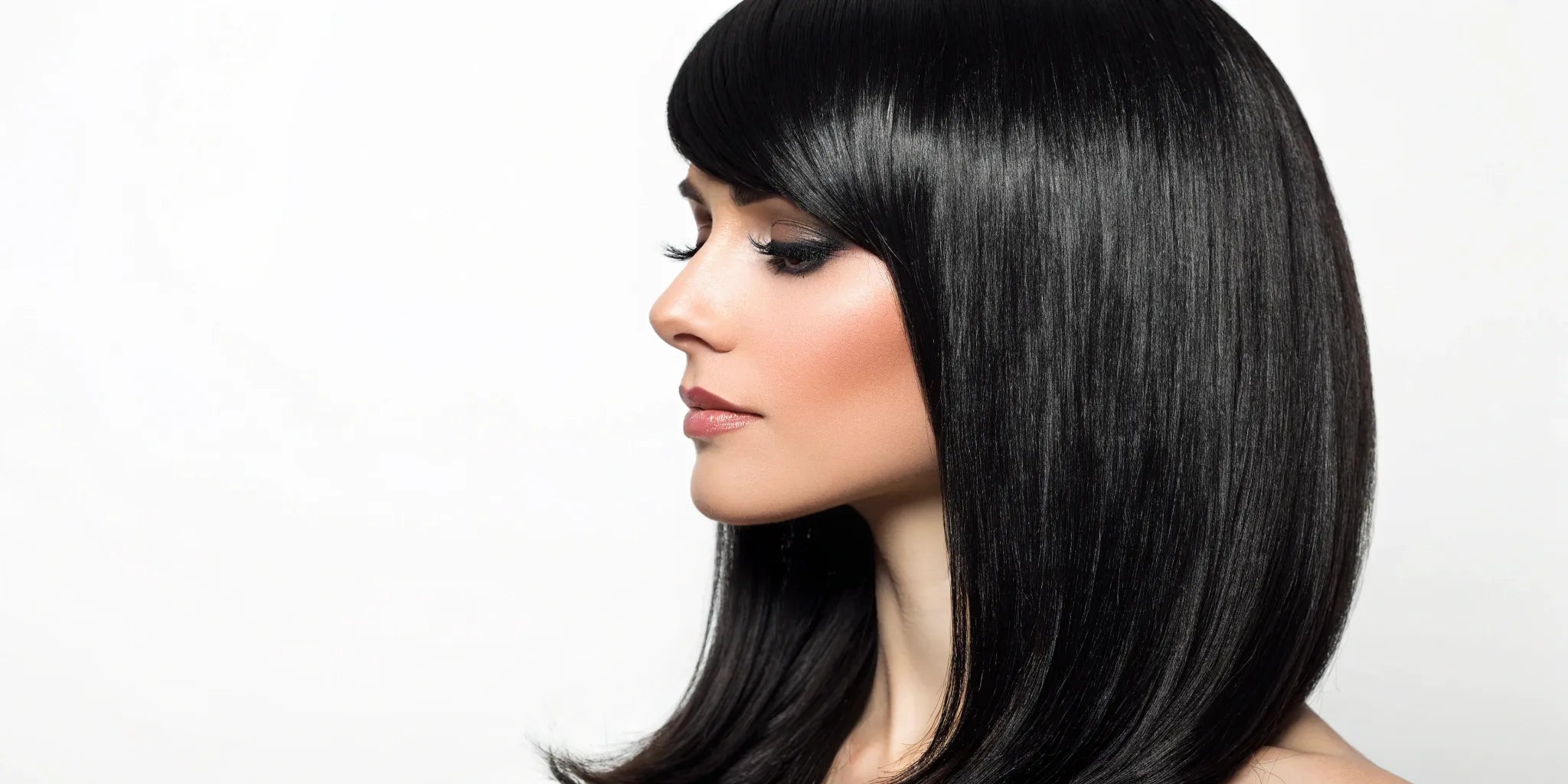 A complete guide to choosing a black wig, shown with a woman wearing a sleek style.