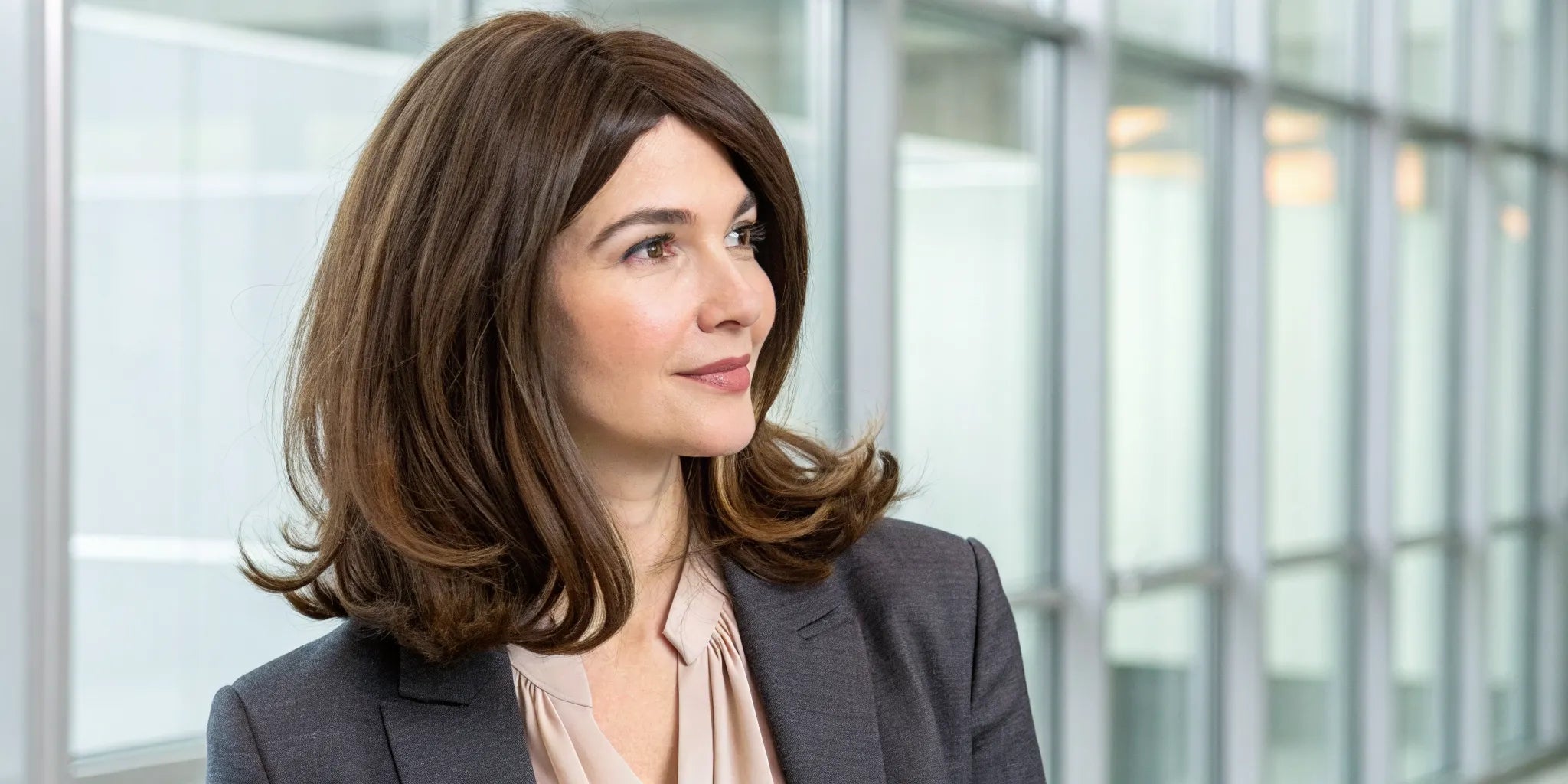 Woman wearing a high-quality, natural-looking brown wig.